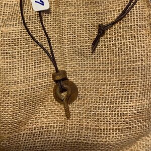 Post apocalyptic style industrial hardware necklace on black leather cord